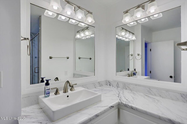 bathroom with vanity and walk in shower