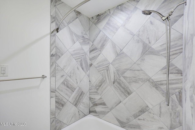 details with tiled shower / bath combo