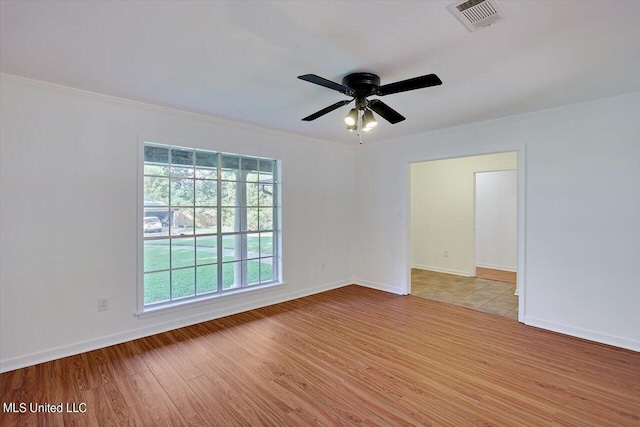 603 Herndon Hl, Clinton, MS 39056 - spare room with wood finished floors, ornamental molding, ceiling fan, and baseboards