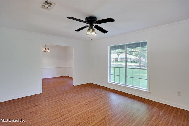 603 Herndon Hl, Clinton, MS 39056 - empty room with light wood finished floors, ornamental molding, a chandelier, baseboards, and a ceiling fan