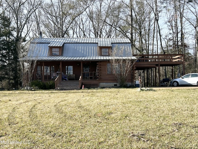 log-style house featuring a front yard and covered porch