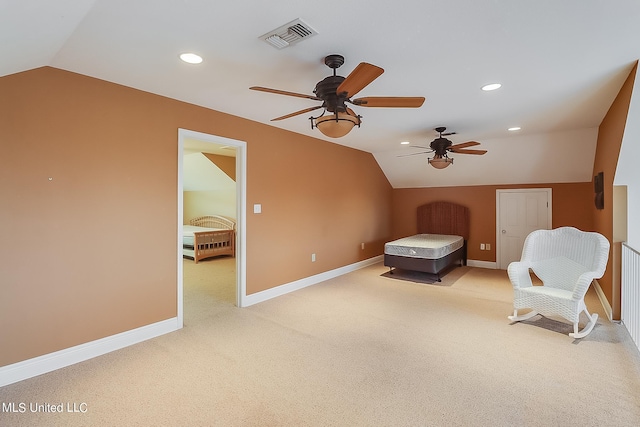 unfurnished room featuring light carpet, lofted ceiling, and ceiling fan