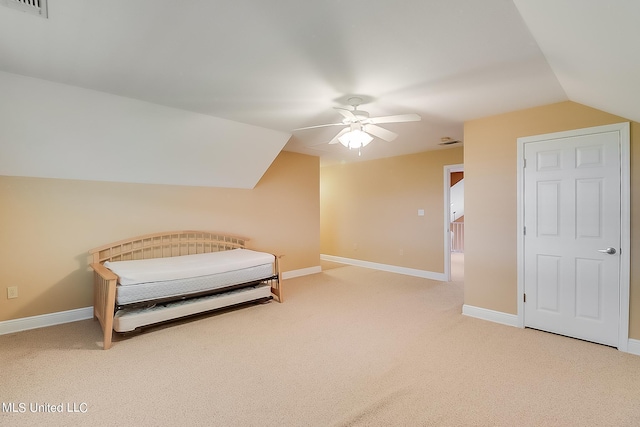 carpeted bedroom with vaulted ceiling and ceiling fan