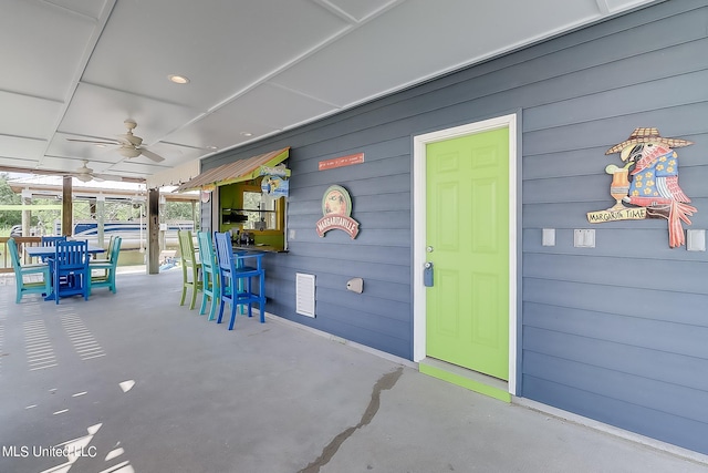 view of patio / terrace featuring ceiling fan