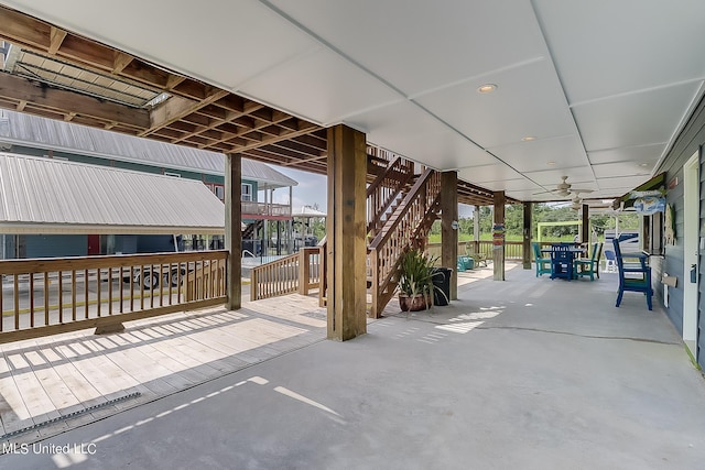 view of patio / terrace with ceiling fan and a deck