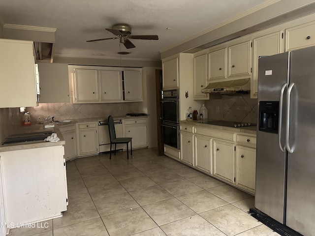 25 Oak Creek Pl, Jackson, MS 39211 - kitchen with black appliances, ceiling fan, under cabinet range hood, tasteful backsplash, and light countertops