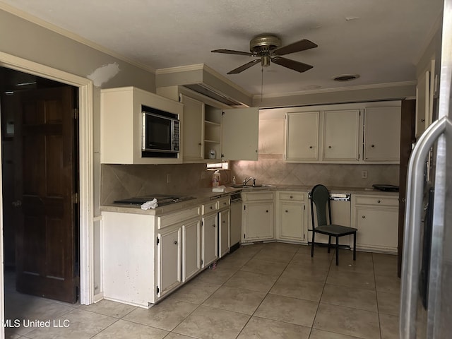 25 Oak Creek Pl, Jackson, MS 39211 - kitchen with stainless steel fridge, black microwave, ceiling fan, backsplash, and crown molding