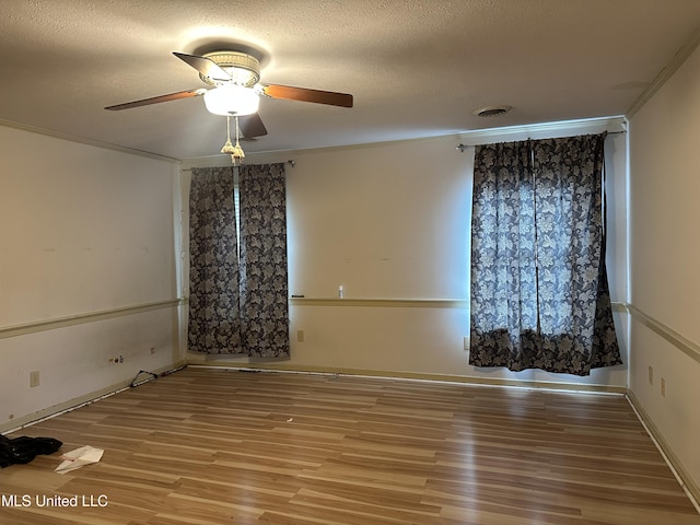 25 Oak Creek Pl, Jackson, MS 39211 - empty room featuring wood finished floors, ceiling fan, a textured ceiling, and crown molding