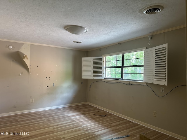 25 Oak Creek Pl, Jackson, MS 39211 - unfurnished room featuring wood finished floors, crown molding, and a textured ceiling