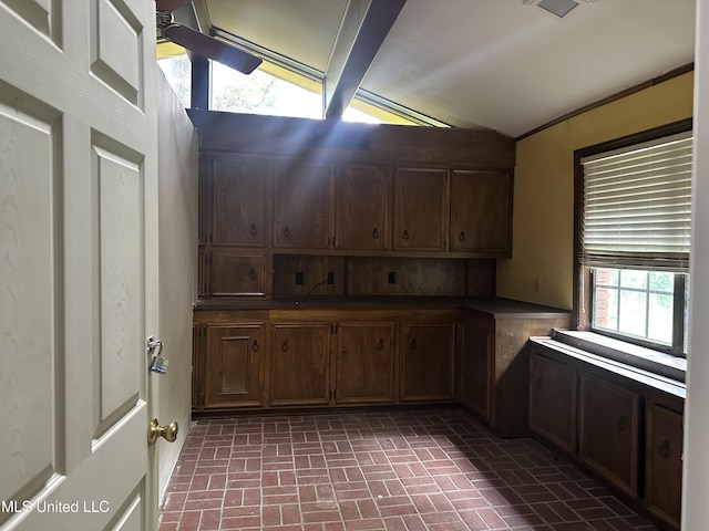 25 Oak Creek Pl, Jackson, MS 39211 - kitchen featuring lofted ceiling, brick patterned floors, and dark countertops