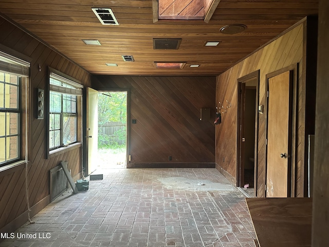 25 Oak Creek Pl, Jackson, MS 39211 - miscellaneous room with wood walls, wooden ceiling, and brick flooring