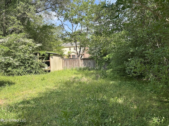 25 Oak Creek Pl, Jackson, MS 39211 - view of yard featuring a storage unit