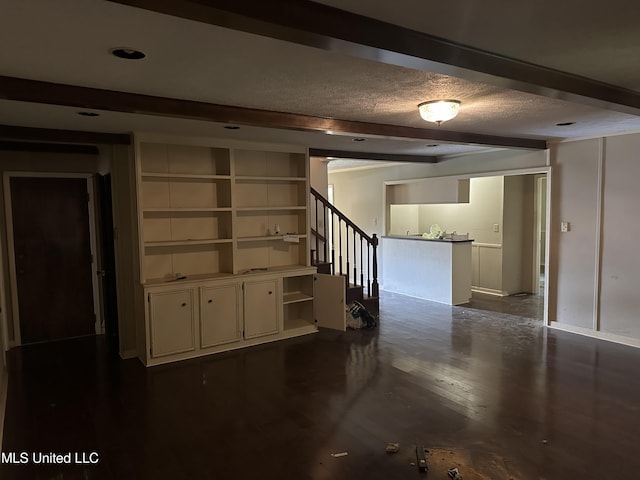 25 Oak Creek Pl, Jackson, MS 39211 - basement with stairs, a textured ceiling, and dark wood finished floors