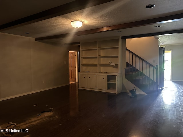 25 Oak Creek Pl, Jackson, MS 39211 - unfurnished living room featuring a textured ceiling, stairs, and dark wood-type flooring