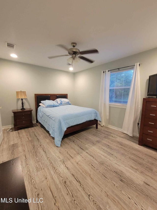 bedroom with wood finished floors, visible vents, recessed lighting, a ceiling fan, and baseboards