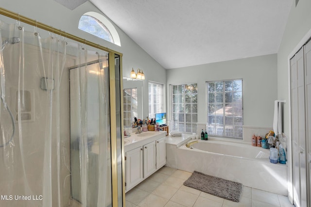 bathroom featuring vanity, a healthy amount of sunlight, independent shower and bath, and a textured ceiling