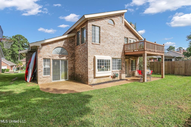 back of house featuring a patio and a yard