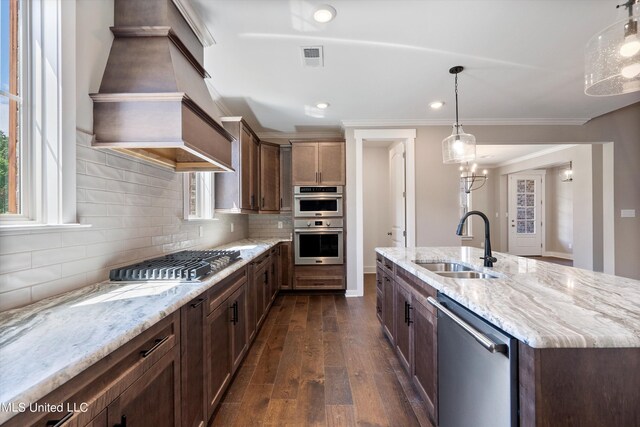 8025 Old Addison Dr, Olive Branch, MS 38654 - kitchen featuring appliances with stainless steel finishes, a sink, custom exhaust hood, dark wood-type flooring, and decorative backsplash