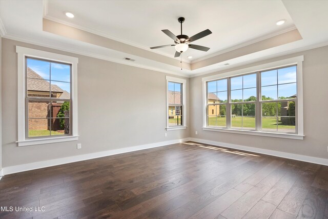8025 Old Addison Dr, Olive Branch, MS 38654 - spare room with a tray ceiling, plenty of natural light, dark wood-style floors, crown molding, and recessed lighting