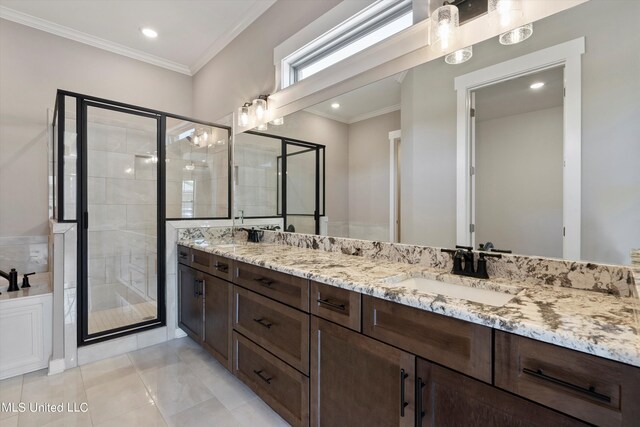 8025 Old Addison Dr, Olive Branch, MS 38654 - full bathroom featuring double vanity, a stall shower, ornamental molding, and recessed lighting