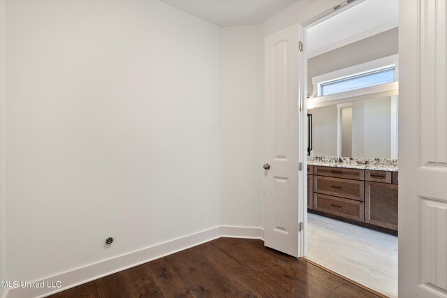 8025 Old Addison Dr, Olive Branch, MS 38654 - empty room featuring wood finished floors and baseboards