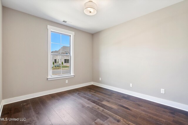 8025 Old Addison Dr, Olive Branch, MS 38654 - spare room with dark wood-style floors and baseboards