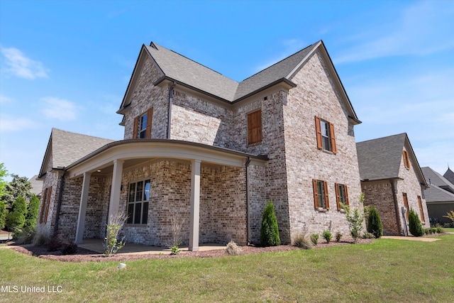 8025 Old Addison Dr, Olive Branch, MS 38654 - view of side of property with a yard, brick siding, and a shingled roof