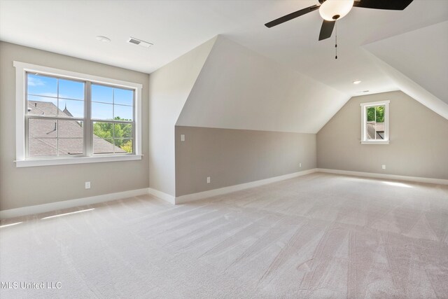 8025 Old Addison Dr, Olive Branch, MS 38654 - additional living space featuring light colored carpet, baseboards, ceiling fan, and lofted ceiling