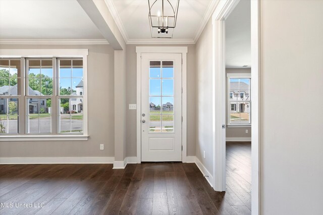 8025 Old Addison Dr, Olive Branch, MS 38654 - foyer entrance with dark wood finished floors, healthy amount of natural light, a chandelier, baseboards, and crown molding