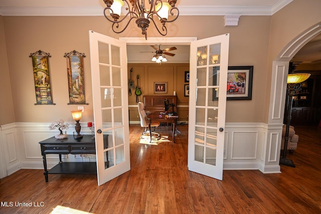 interior space featuring french doors, ceiling fan, ornamental molding, and hardwood / wood-style flooring