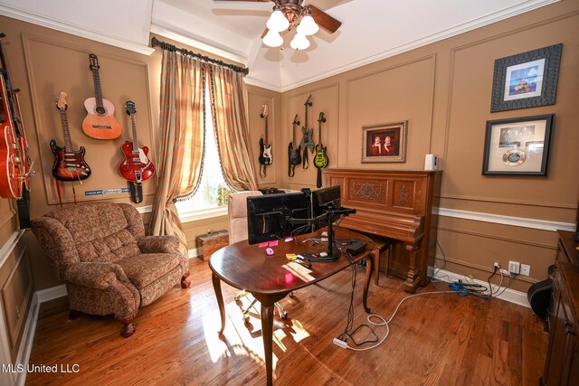 sitting room with crown molding, hardwood / wood-style floors, and ceiling fan