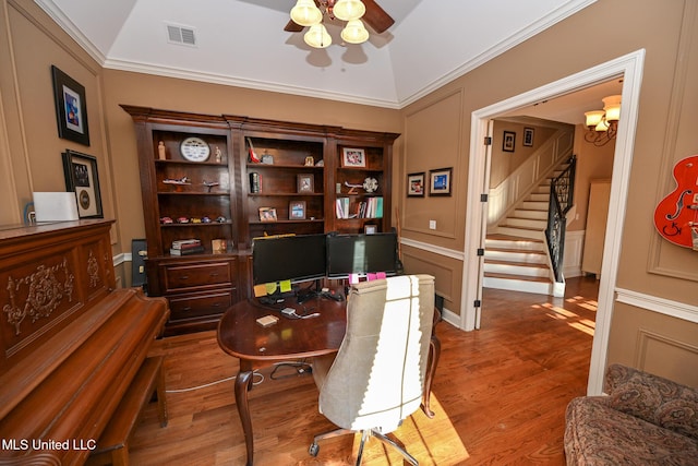 home office featuring crown molding, ceiling fan, vaulted ceiling, and light hardwood / wood-style flooring