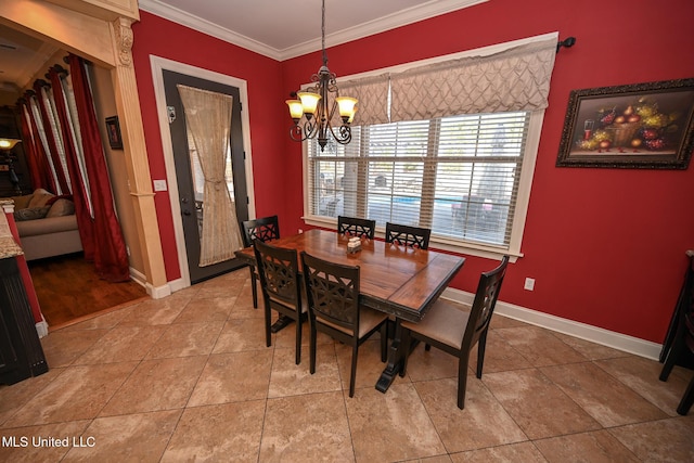 dining space featuring light tile patterned floors, ornamental molding, and a chandelier