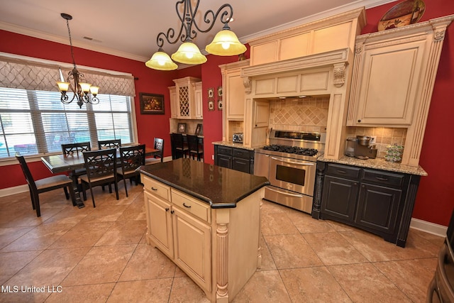 kitchen with custom exhaust hood, tasteful backsplash, a center island, pendant lighting, and high end stove