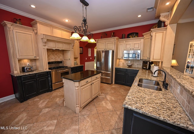 kitchen with appliances with stainless steel finishes, a center island, sink, and decorative backsplash