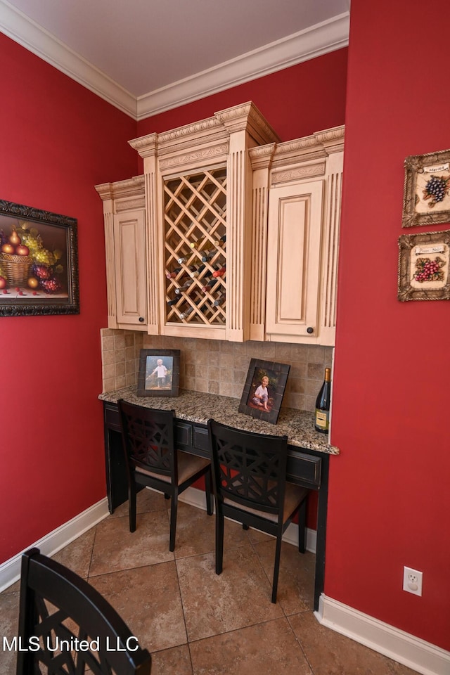 interior space featuring crown molding and indoor bar