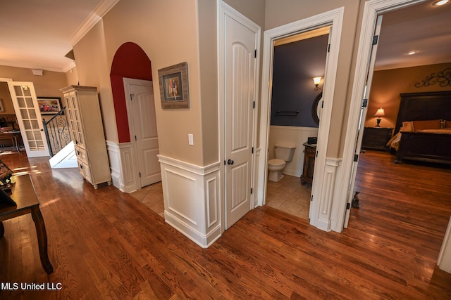 hallway featuring crown molding and hardwood / wood-style flooring