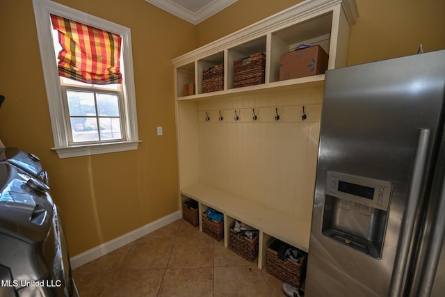 mudroom featuring ornamental molding and light tile patterned flooring