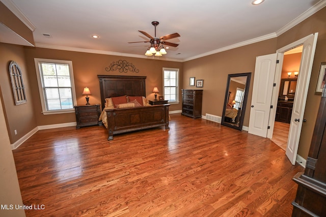 bedroom featuring ceiling fan, ornamental molding, and hardwood / wood-style floors