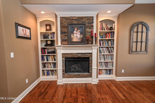 4111 Sir Thopas Dr, Southaven, MS 38654 - unfurnished living room with wood-type flooring, crown molding, built in features, and a fireplace