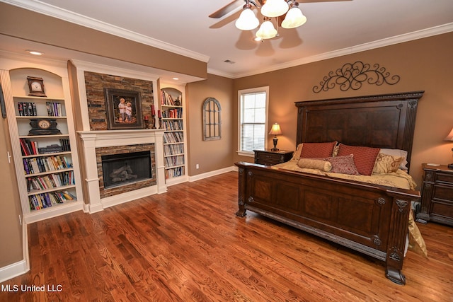 4111 Sir Thopas Dr, Southaven, MS 38654 - bedroom with dark hardwood / wood-style flooring, ornamental molding, a stone fireplace, and ceiling fan