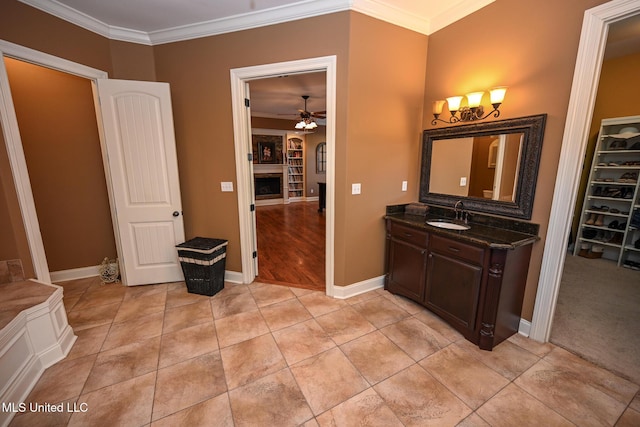 4111 Sir Thopas Dr, Southaven, MS 38654 - bathroom with ceiling fan, ornamental molding, tile patterned flooring, and vanity