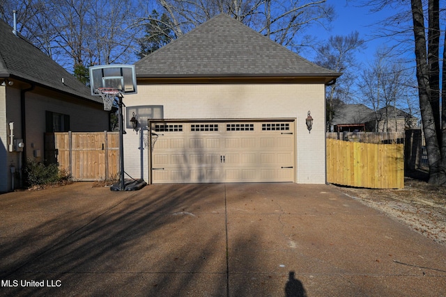 view of property exterior featuring an outbuilding and a garage