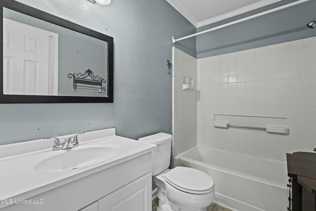 full bath featuring washtub / shower combination, vanity, crown molding, and toilet