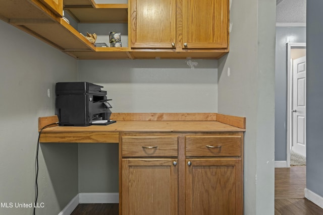 office featuring baseboards and dark wood-style floors