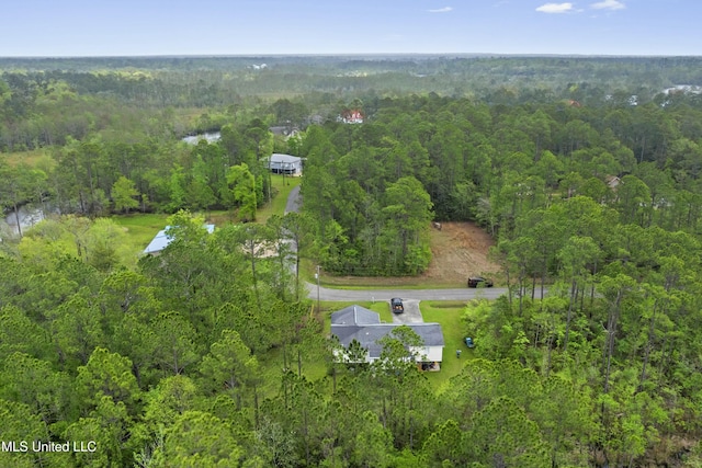 drone / aerial view with a view of trees