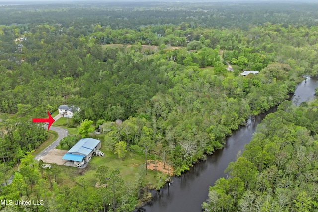 aerial view with a forest view and a water view