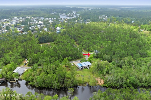 bird's eye view featuring a view of trees and a water view