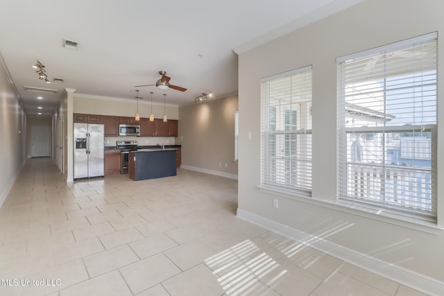 200 Jeff Davis Ave Unit 8, Long Beach, MS 39560 - kitchen with stainless steel appliances, ornamental molding, open floor plan, baseboards, and light tile patterned floors
