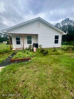 152 Bexley Rd, Lucedale, MS 39452 - back of property featuring a lawn